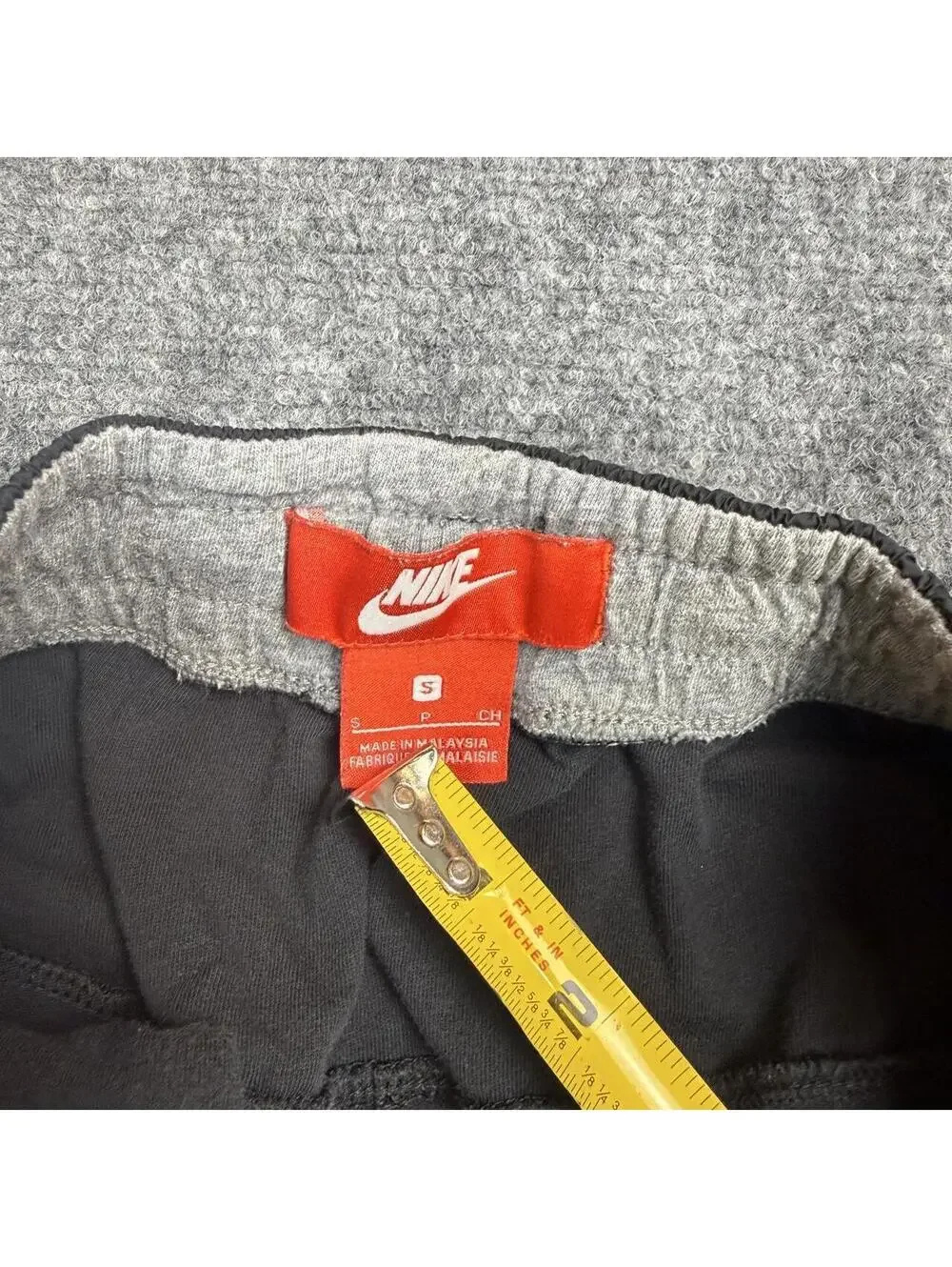 Nike black joggers with drawstring waist and tapered fit, size S